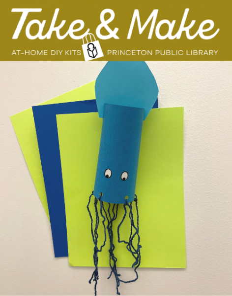 Blue paper squid against sheets of green and blue paper